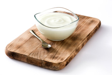 Greek yogurt in glass bowl isolated on white background
