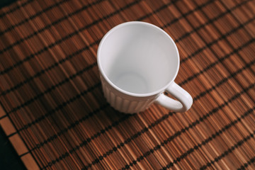 bright mug on the table, wooden background