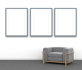 3d interior rendering of interior scene with fabric armchair and three blue blank picture frames on the wall