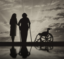 Disabled persons on crutches in reflection and nurse