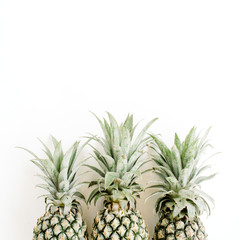 Three pineapples. Flat lay, top view