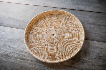 Wicker placemat on wooden