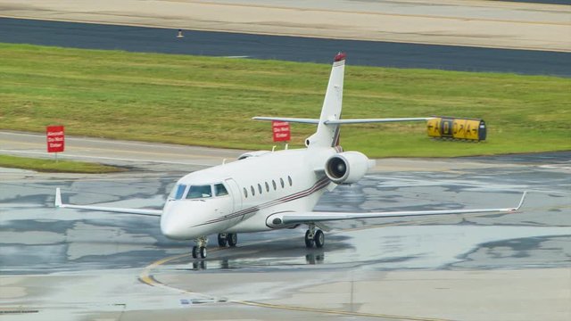 Private Aviation Executive Business Jet driving on an Airport Taxiway after landing at Atlanta International