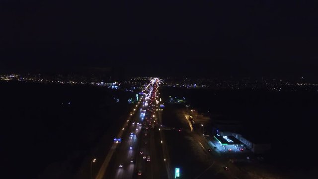 4K Aerial. Night City  cars traffic highway with fires