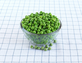 Healthy food cooked peas in a glass bowl.