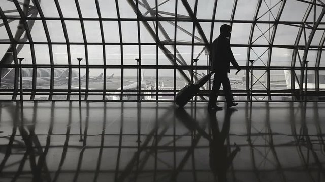 Silhouettes of Travellers in Airport