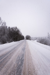 Obraz premium winter road in the woods