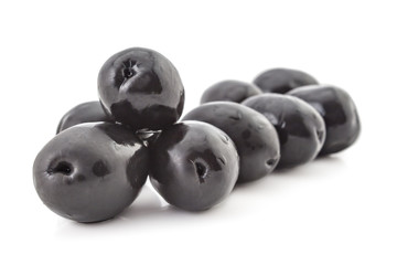 Heap of fresh raw black olives, isolated on white background