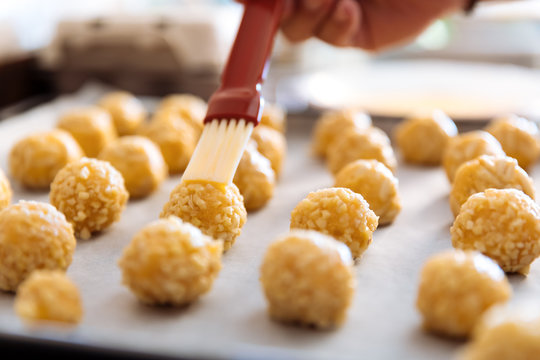 Woman kneading marzipan for make panellets.