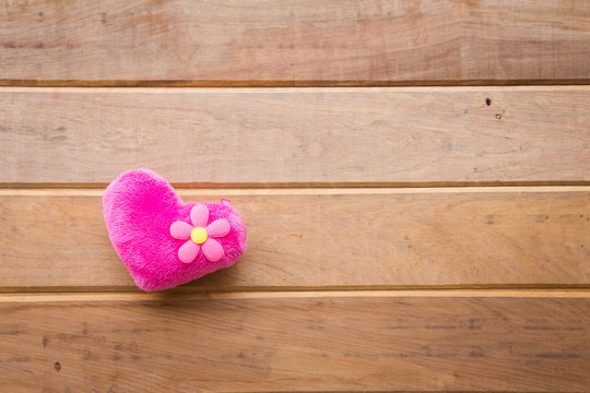 Pink heart on rustic wooden background, Valentine concept
