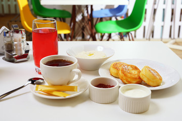 Set breakfast with porridge and cheesecakes