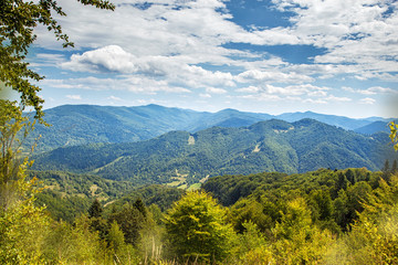 Summer landscape in mountains and the dark blue sky with clouds
