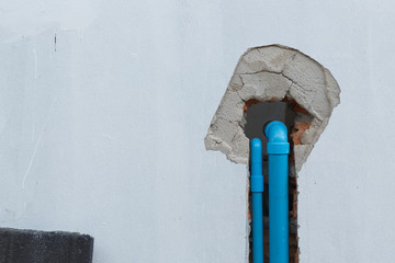 water pipe pvc plumbing under cement wall in construction site