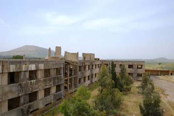 Fototapeta premium After war. The thrown buildings in the demilitarised zone on the Syrian-Israeli border