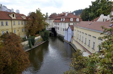 Fototapeta na wymiar Old mill from Prague and park