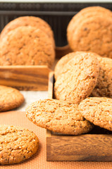 Many of oatmeal cookies in two wooden boxe