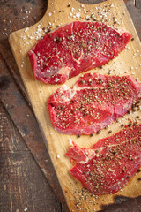 Obraz premium Fresh beef steak and spicel on board