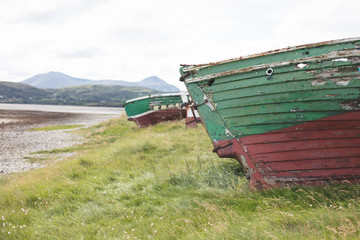 Fototapeta premium Shipwrecked fishing boats at magheroarty beach, County Donegal.