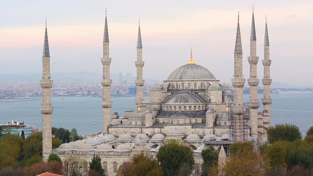 Aerial view of Blue Mosque in Istanbul. This is one of the most important islamic place where people go to pray. On background there are Bosphorus strait and Asian side of the city.