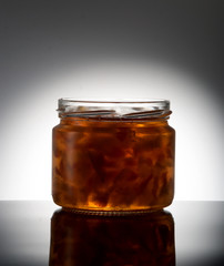 Jar with jam on black and white background