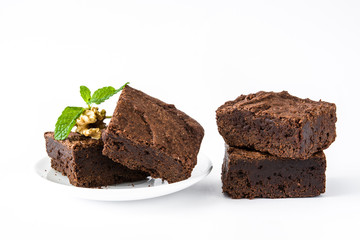 Chocolate brownie pieces isolated on white background
