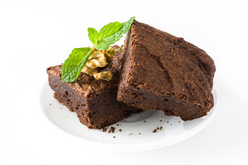 Chocolate brownie pieces isolated on white background
