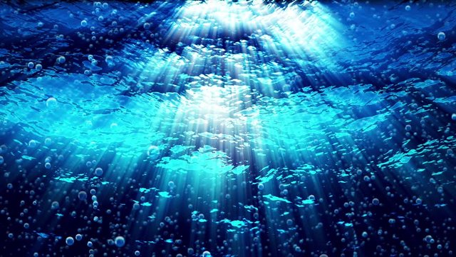 Underwater ocean waves ripple as bubbles rise (Video Loop).