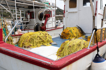 Fishing boat with yellow nets
