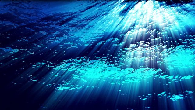Underwater ocean waves ripple and flow with light rays (Loop).