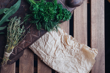 Cooking ingredients - pepper, bok choy, thymus and parsley arranged at the canvas background