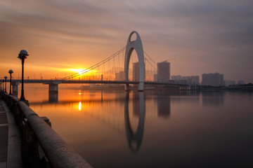 Fototapeta premium Modern bridge in Zhujiang River and modern building of financial district in guangzhou city, china
