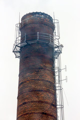 Old factory chimney closeup on white background