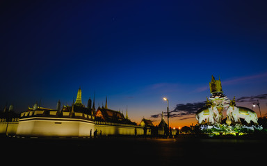 Night view image of  statues of Thai White Elephants and symbols Thailand King Rama 9,in front of the Grand Palace or Emerald Buddha Temple.