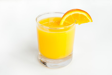Obraz na płótnie Canvas Glass of orange juice with slice.
