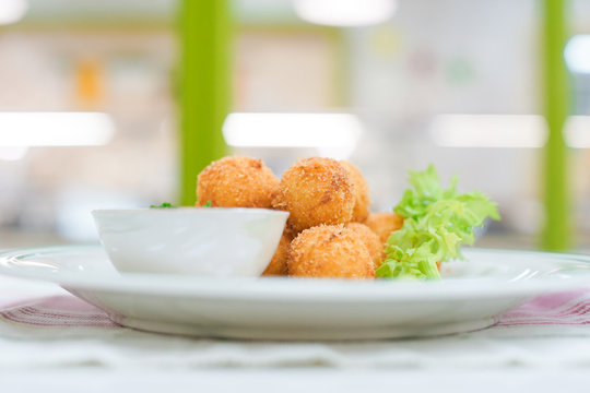 Delicious crispy Cheese ball in paper bucket isolated on white background, Cheese  ball or cheesy puffs on white With clipping path. Stock Photo