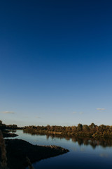 The river with a quiet current and clouds reflected in it, Soz , Gomel, Belarus