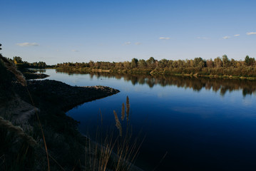 The river with a quiet current and clouds reflected in it, Soz , Gomel, Belarus