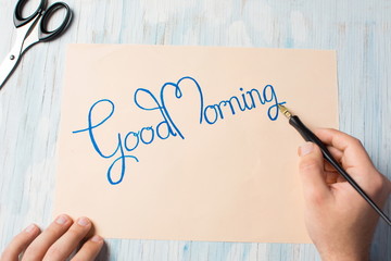 Writing a good morning note top view