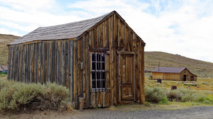Fototapeta na wymiar Abandoned dwellings in the 19th Century gold mining ghost town of Bodie, California, a State Historic Park
