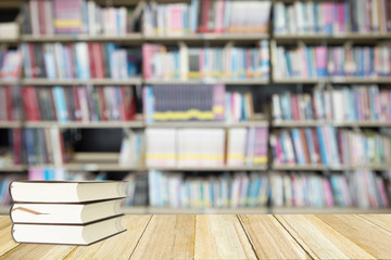 wood terrace and blur from shelf of books in library.