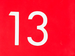 Number 13 on red wall with halloween day