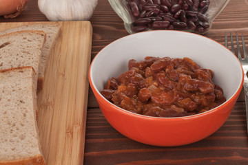 Chili Con Carne in bowl on wooden table