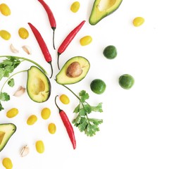 Raw food: avocado, chili pepper, coriander, cherry tomato, lime, garlic. Flat lay, top view. Food concept.