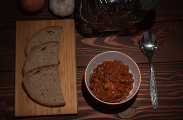 Chili Con Carne in bowl  on wooden table