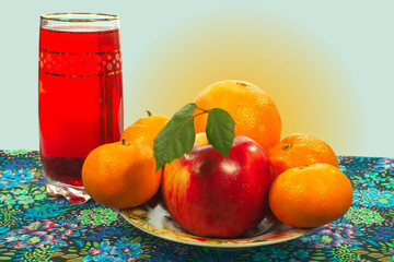 apple and citrus fruit on a plate, a glass of juice