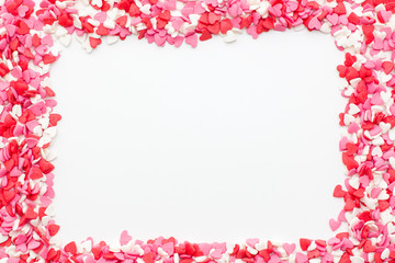 the frame is made up of many small hearts on a white background. festive background for Valentine's day, birthday, holiday.
