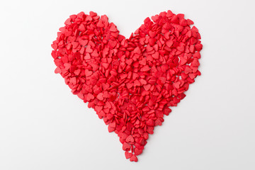 red heart made of many smaller hearts on a white background. festive background for Valentine's day, birthday, holiday