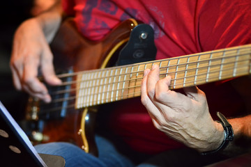 Fototapeta na wymiar Playing Bass Guitar