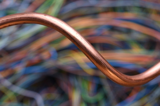 Copper Wire Closeup with Blurred Industrial Background
