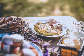 Various breakfast table with fruits egg and sausage, orange juice and milk